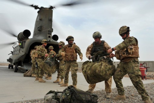 RM Commandos in MTP camo load a transport helicopter in Afghanistan